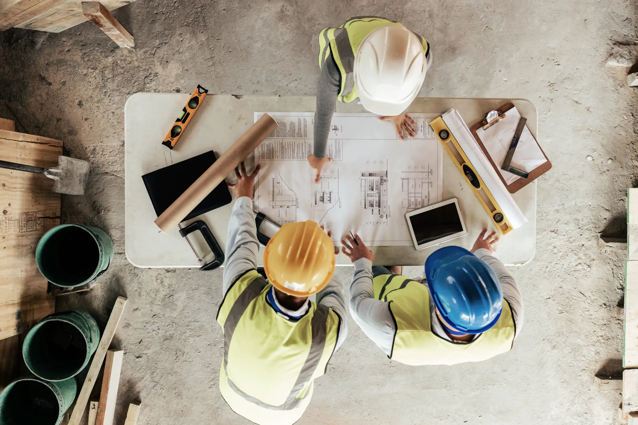 Top view, construction workers or blueprint planning in house